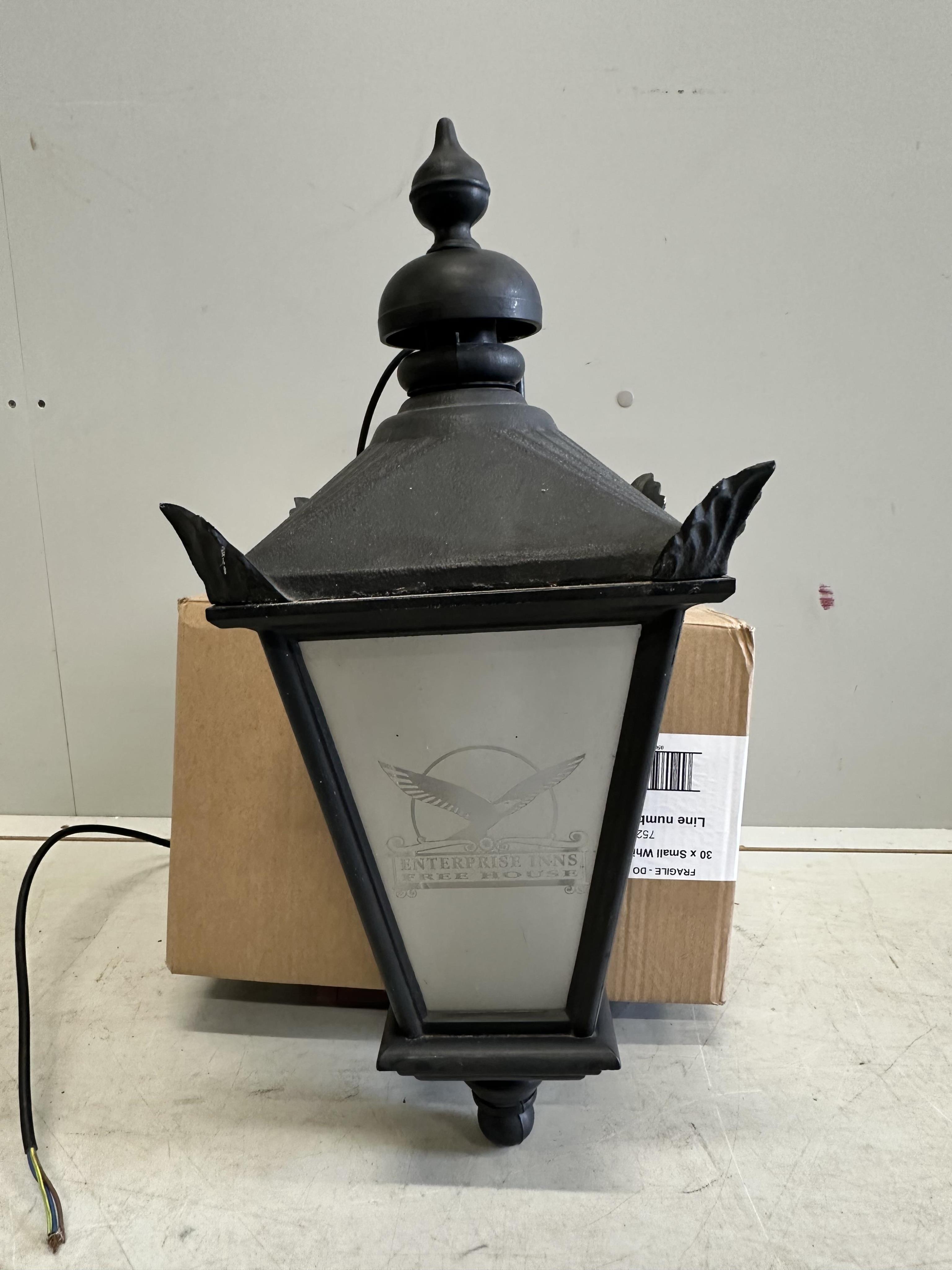A set of four cast metal lantern wall lights with perspex windows, height 60cm. Condition - fair